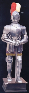 Medieval Armour (Decorative), Armours - Medieval Armour - Medieval armour has been made in polished steel, provided with an arabesqued fabric gown, two ostrich plumes inserted in the apposite holder of the helmet (not shown, available in different colours), sword and wooden platform reinforced with metallic angles.