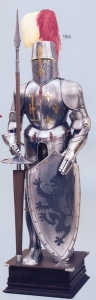 Medieval Armour, Armours - Medieval Armour - The Medieval armour has been made in polished steel, ornated with a potent cross and three fleur-de-lys fixed on the chest and characterized by a panoplia fit for tournaments: a great helm fastened with leather belts, a jousting lance and a metal shield.