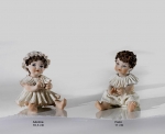 Sibania Porcelain Figurines - Porcelain sculpture depicting little girl sitting, Adelina - Paco, height 11 cm (4.3 in), Wonderful porcelain sculpture, entirely handmade in Italy.