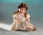 Sibania Porcelain Figurines - Porcelain sculpture depicting little girl sitting, Anita, height 14.5 cm (5.7 in).