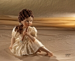 Sibania Porcelain Figurines - Porcelain sculpture depicting little girl sitting, Arianna, height 20 cm (7.9 in).