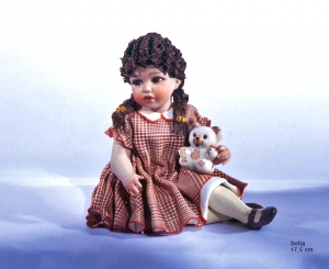 Sculpture depicting little girl sitting, Sofia, Sibania Porcelain Figurines - Porcelain Figurines Sibania - Porcelain sculpture depicting little girl sitting, Sofia, height 17.5 cm (6.89 in), Wonderful porcelain sculpture, entirely handmade in Italy.