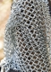 Armours - Medieval Body Armour - A pair of socks in wire mesh, protection for the legs worn by warriors on horseback made by hand and twisted metal rings with leather belts to be worn.