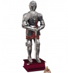 Armours - Medieval Armour - The armour has been made in polished steel, characterized by floreal etchings on some parts and elaborated relief figures on others that make this model particularly rich. Provided with an arabesqued fabric gown.